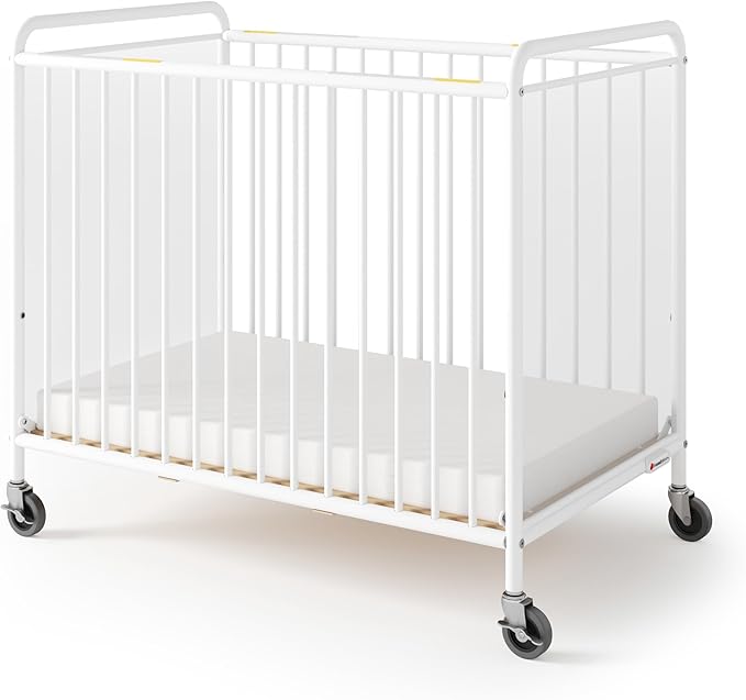 Foundations Chelsea Clearview Metal Compact Daycare Crib, 3" Casters, Compact Mini Size, Easy to Clean Durable Finish, Adjustable to Two Heights Mattress Board (White)